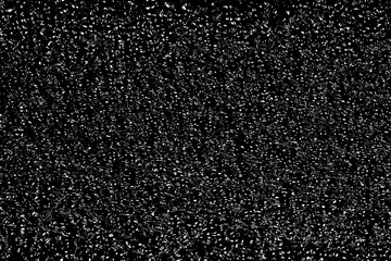 Chaotic white bokeh on a black background. light spots texture. abstraction. falling snow. starry sky. bright glare of light texture