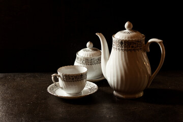 antique tea cup isolated on dark backgrounds