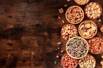 Nut background with copy space. Various nuts, shot from the top