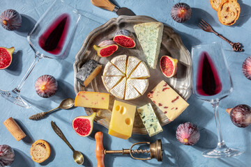 Cheese and wine, shot from above. Camembert, blue cheese and other cheeses