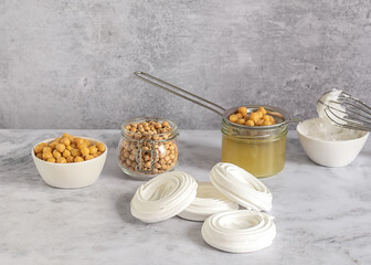 Vegan cooking concept. Meringue from canned chickpea water aquafaba. Healthy product. Eggs replacement and substitute. Top view, copy space for recipes.