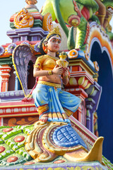 Beaituful Angel statue on hindu temple tower