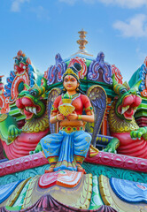 Beaituful Angel statue on hindu temple tower	
