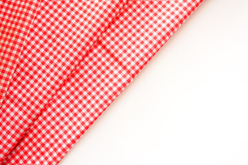 Classic pink plaid fabric or tablecloth on white background with copy space. 