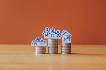 Stack of money coin on wood desk with brown background, Finance concept or Saving money for family,...