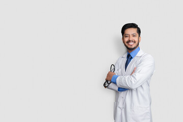 Young doctor male cross arms over isolated background laughing
