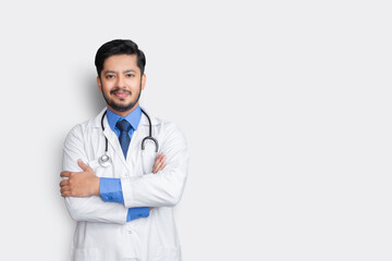 Portrait of male doctor with stethoscope & arm cross isolated on white background. Health insurance concept.