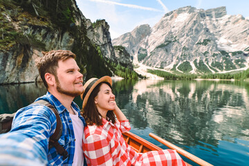 couple romantic date at boat on mountain lake