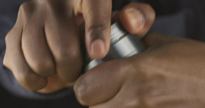 Grinding weed in buster