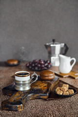 Vintage cup with espresso coffee, chocolate cake and grapes
