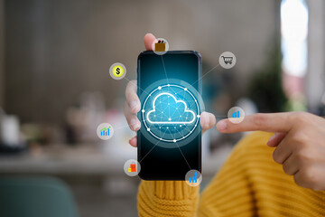 Female using smartphone with icon graphic cloud cyber security network of connected devices and personal data security.