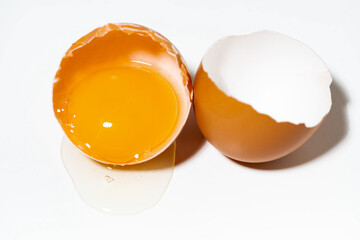 broken chicken egg on white background