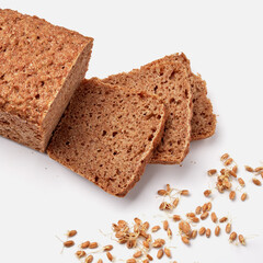 sliced rye bread on a white plate with pumpkin seeds