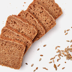 sliced rye bread on a white plate with pumpkin seeds