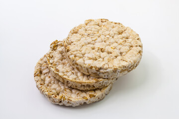 Pile of three round crispy popcorn and rice bread. Isolated on a white background.