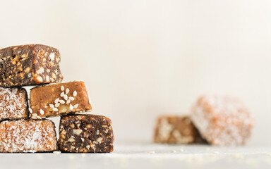 Homemade vegan healthy sugar free candies made of dried fruits. Copy space.