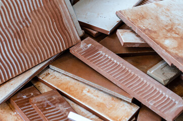 Stacked rectangular scraps of ceramic tiles