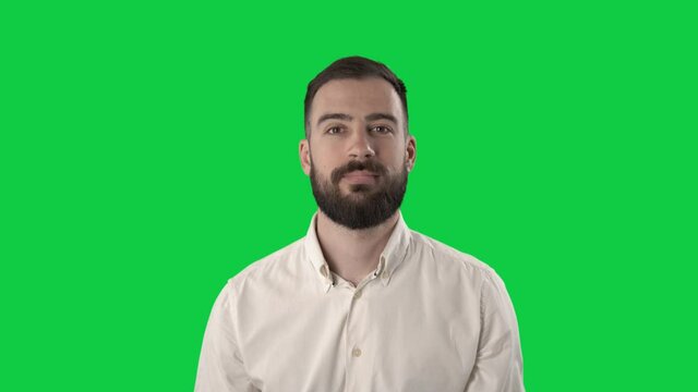 Uncertain apathetic young business man with apologizing look. Portrait on green screen background.