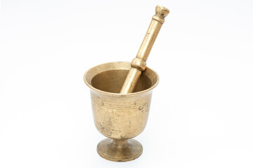 Antique and aged pestle and mortar on the white background.