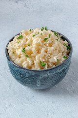 White rice with parsley in a bowl