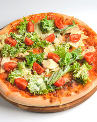 Caesar pizza isolated on white background. Italian pizza with caesar salad filling.