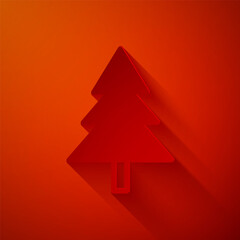 Paper cut Christmas tree icon isolated on red background. Merry Christmas and Happy New Year. Paper art style. Vector