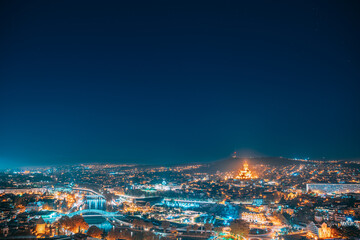 Tbilisi, Georgia. Elevated Rooftop View Of Famous Landmarks In Night Illuminations. Georgian Capital Skyline Cityscape. Night City Center