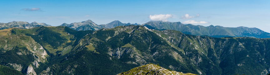 Amazing Retezat mountain range from Cadea Oslei hill summit in Valcan mountains in Romania