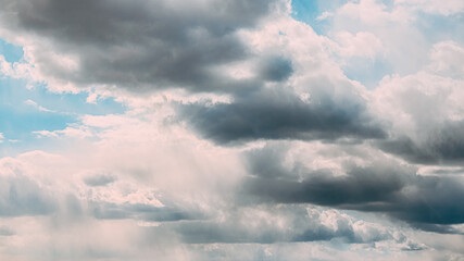 Fototapeta na wymiar Cloudy Sky With Fluffy Rain Clouds. Natural Background