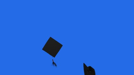Slow motion of graduation caps thrown on the air in the studio with blue screen background
