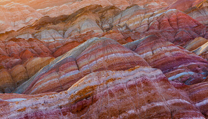 Close-up at sunrise of the Colorful eroded badlands in the Zhangye Danxia National Geopark, Gansu Province, China