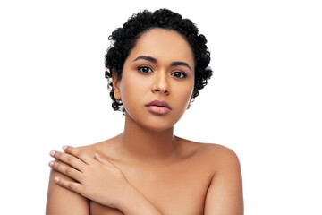 beauty and people concept - portrait of young african american woman with bare shoulders over white...