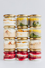 Trendy organic desserts in jars on a solid background. Concept for cafes, restaurants and restaurants with healthy products