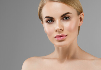 Beautiful young woman with healthy clean skin natural make up healthy blonde hair beautiful eyes and lips