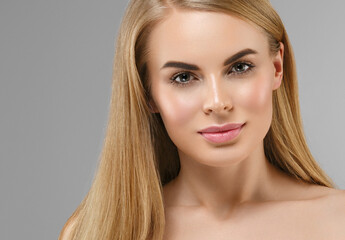 Fototapeta premium Beautiful young woman with healthy clean skin natural make up healthy blonde hair beautiful eyes and lips