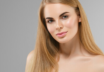 Naklejka premium Beautiful young woman with healthy clean skin natural make up healthy blonde hair beautiful eyes and lips