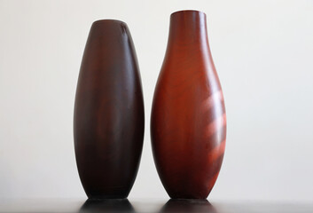 two wooden vases