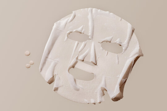 facial sheet mask on brown background. 