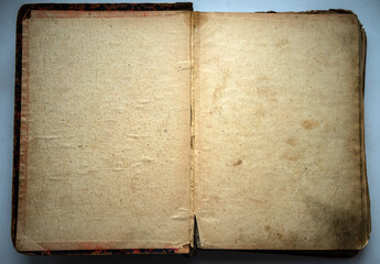 A very old book with yellowed pages on white isolate. Photo of the texture of old paper.