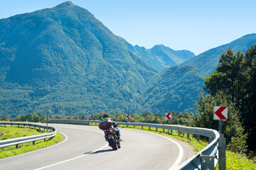 Motorbike on a mountain road curve