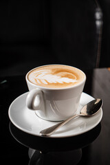 cup of cappuccino in the coffee shop