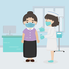 Coronavirus vaccination concept. Nurse gives vaccine shot to shoulder of elderly in hospital.