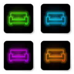 Glowing neon line Sofa icon isolated on white background. Black square button. Vector