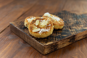 Tofu pancakes on a wooden board. Vegan food, sugar, gluten and lactose free.