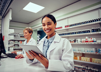 Cheerful happy pharmacist chemist woman working in pharmacy drugstore