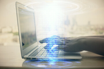 Double exposure of woman hands working on computer and data theme hologram drawing. Tech concept.