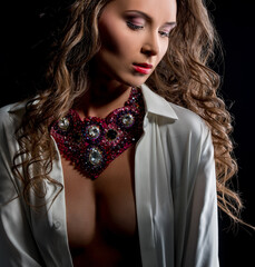 Glamour. Photo of sensual woman posing in jewels
