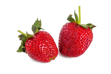 Two ripe red strawberries with green leaves, on a white