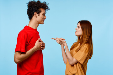 cheerful young couple in colorful t-shirts youth style cropped view