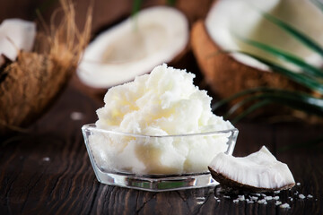 MCT Coconut butter or oil. Organic healthy food, beauty and SPA product. Wooden background. Copy...